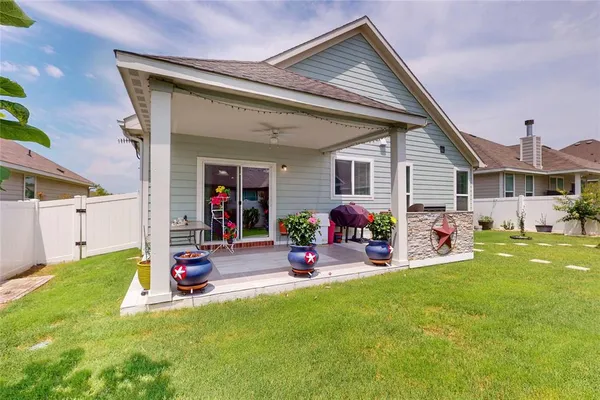 a view of a house with swimming pool and porch