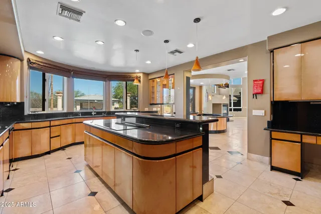 a view of a hallway with entryway windows