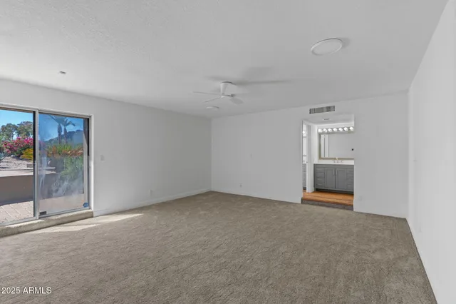 a view of a tennis court with houses
