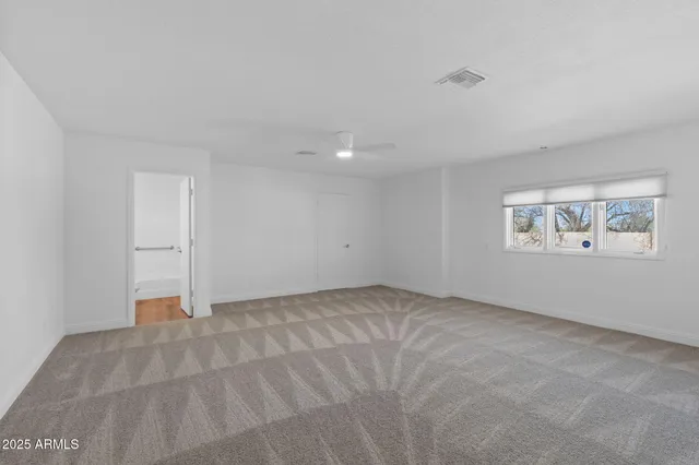 a front view of a house with a garden and plants