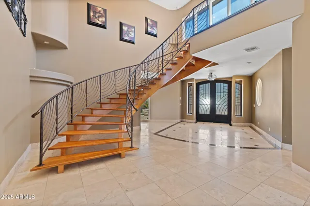a living room with furniture kitchen and a fireplace