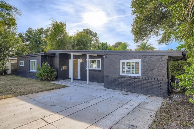 front view of a house with a garden