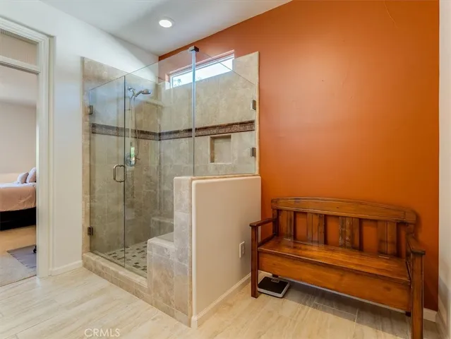 a bathroom with a shower and a sink