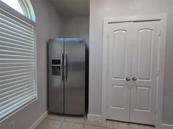 a view of a refrigerator in kitchen