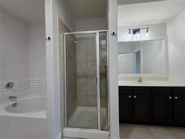 a bathroom with a bathtub and a sink
