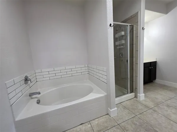 a spacious bathroom with a bathtub