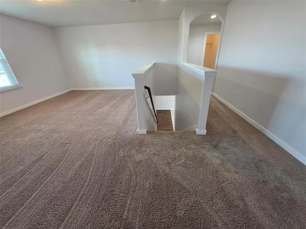 an empty room with a mirror