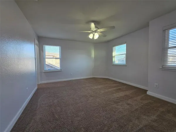 a view of empty room with windows
