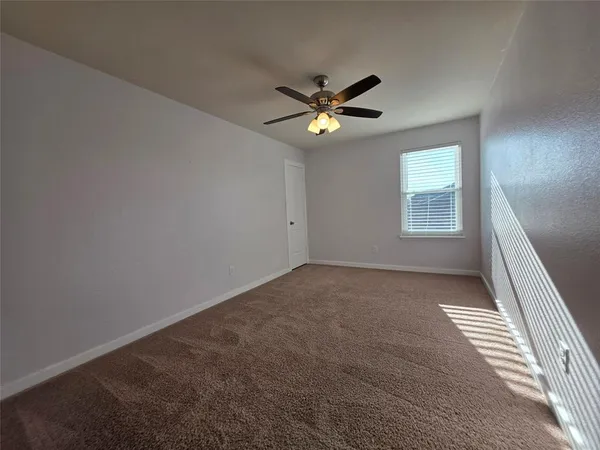 a view of empty room with windows