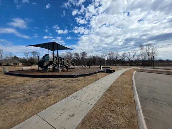 a view of a swimming pool with a patio