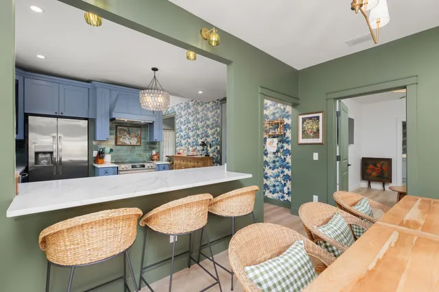 a view of a vase of flowers sitting on a table