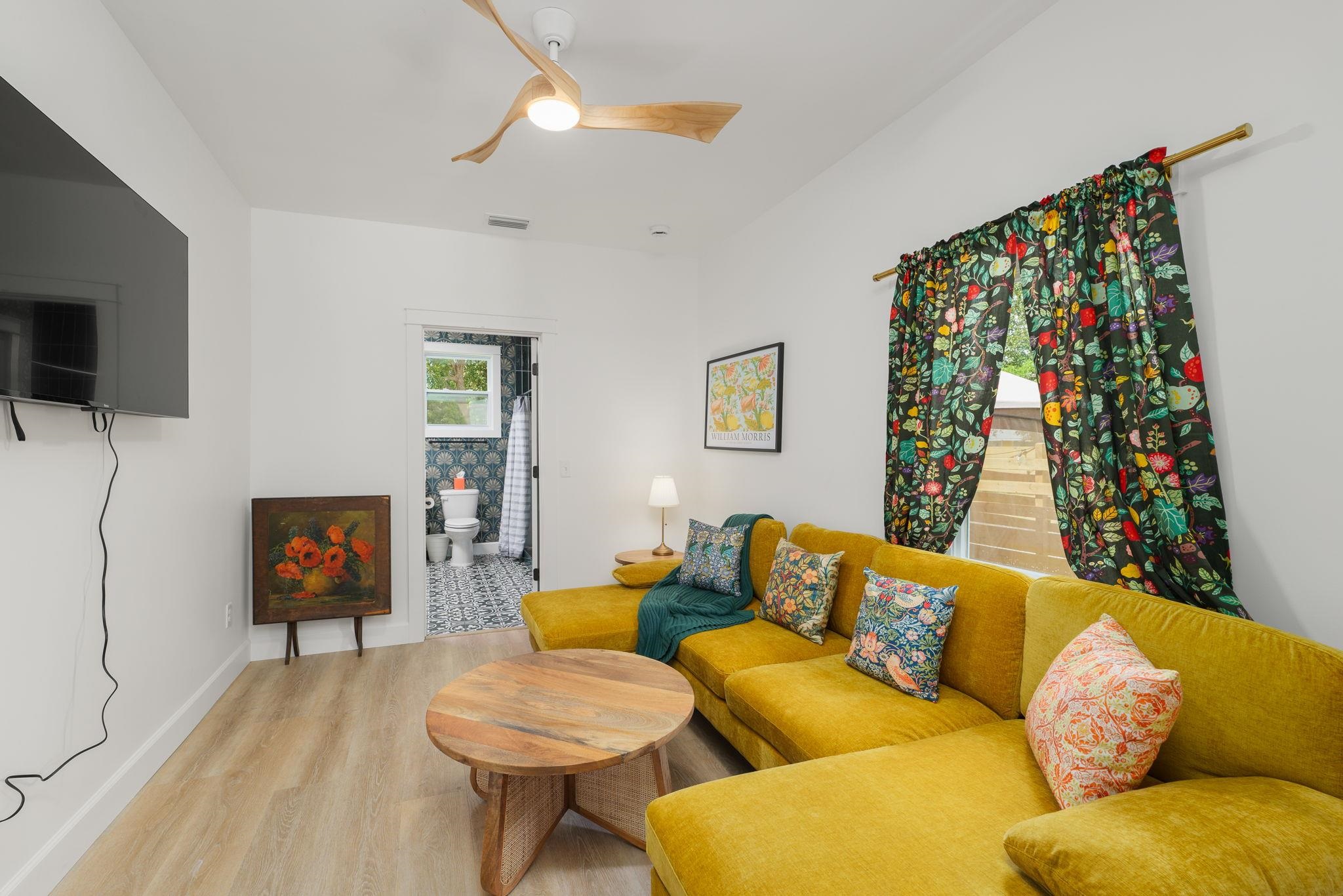 52 Spring Street St. Augustine, FL 32084 - Photo 19 of 45 a living room with furniture and a flat screen tv
