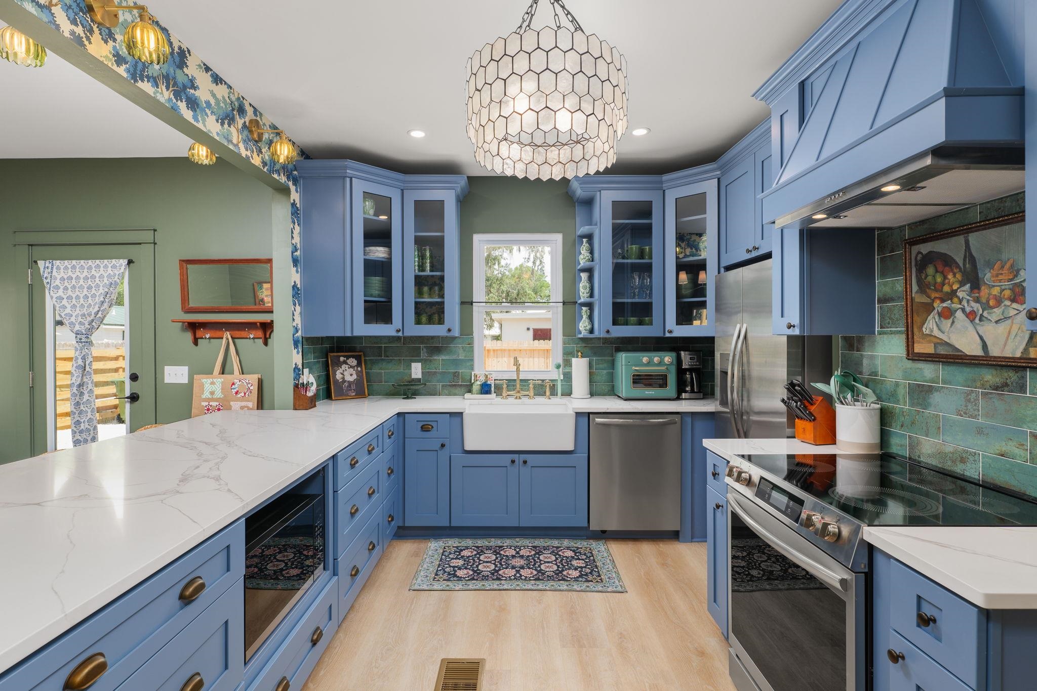 52 Spring Street St. Augustine, FL 32084 - Photo 2 of 45 a kitchen with stainless steel appliances granite countertop a stove a sink dishwasher and cabinets with wooden floor