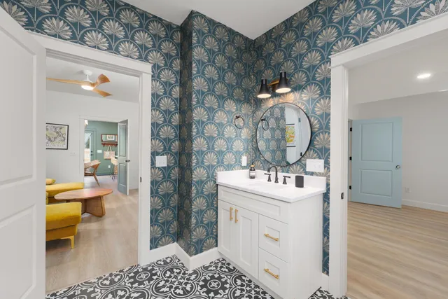 a bathroom with a toilet and a shower curtain