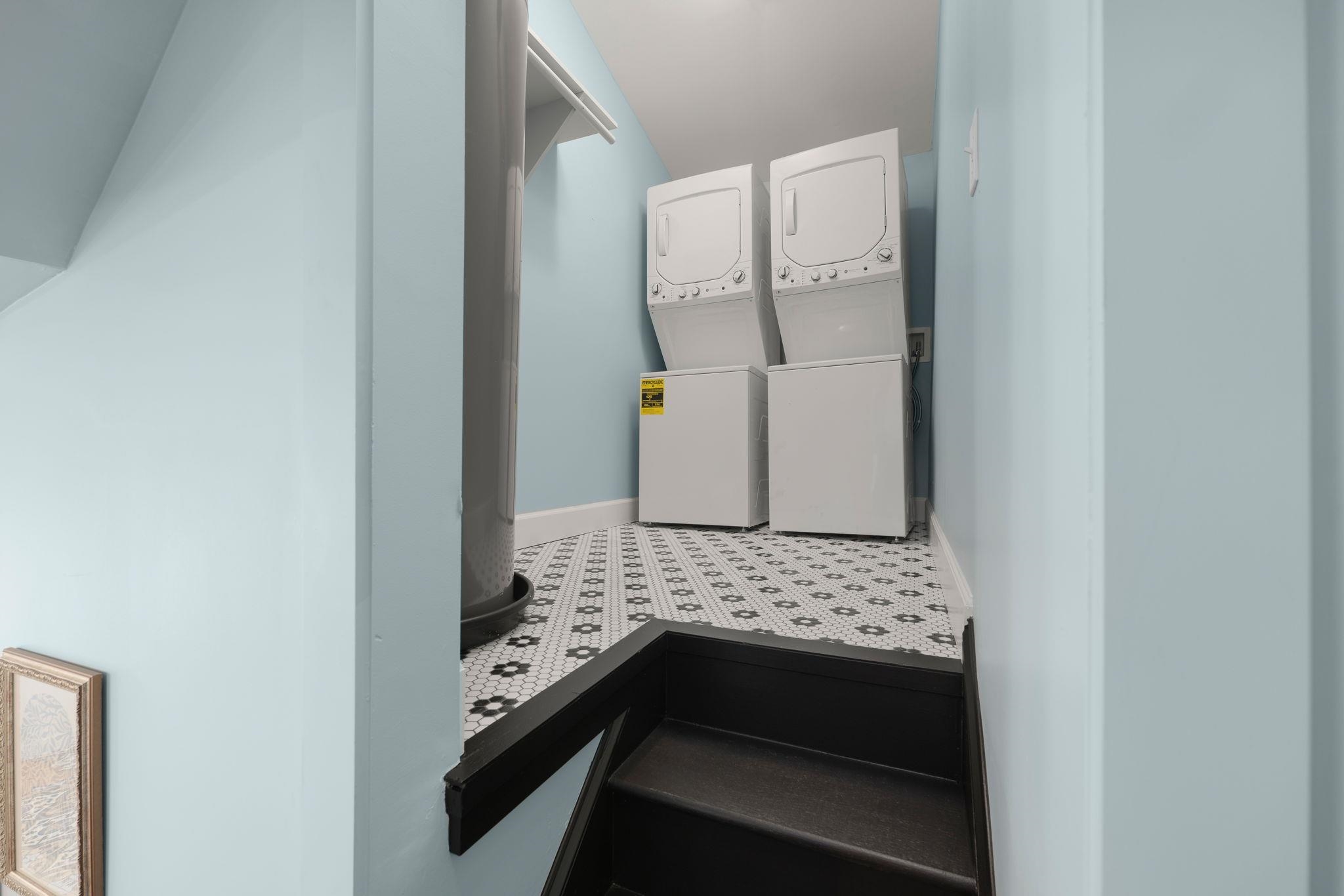 52 Spring Street St. Augustine, FL 32084 - Photo 25 of 45 a bathroom with a granite countertop sink and a mirror