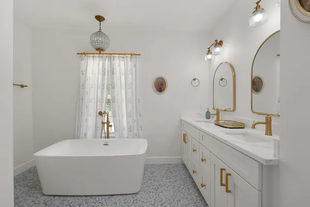 a bedroom with a bed and a lamp