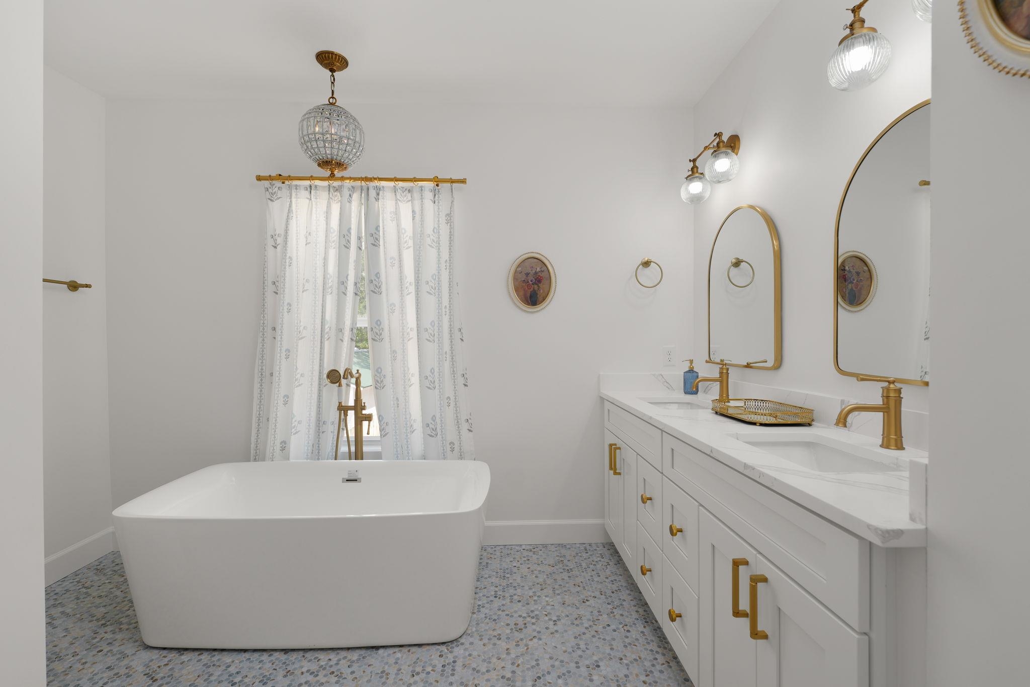 52 Spring Street St. Augustine, FL 32084 - Photo 31 of 45 a bathroom with a double vanity sink mirror and bathtub