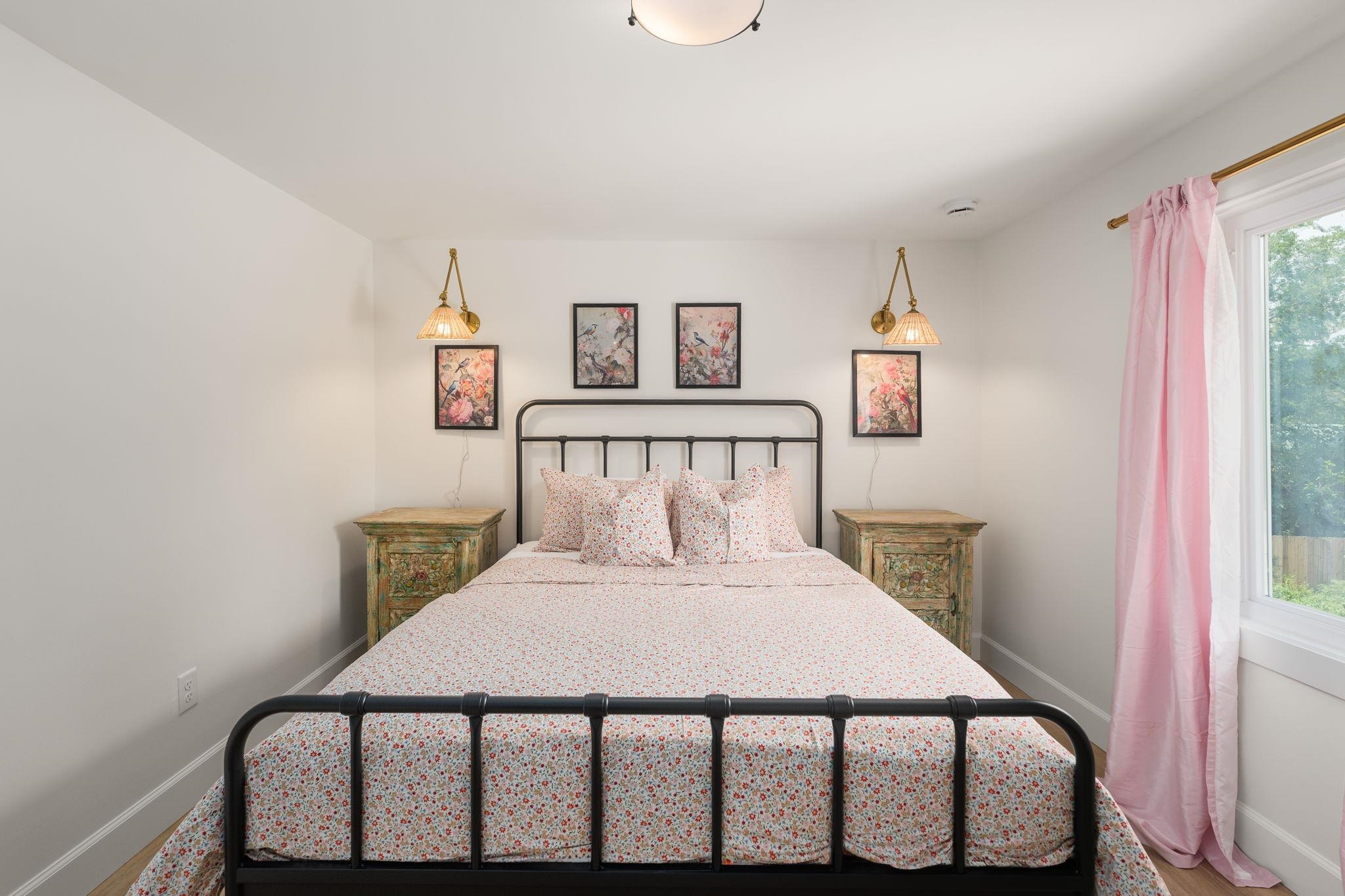 52 Spring Street St. Augustine, FL 32084 - Photo 33 of 45 a bedroom with a bed and a lamp