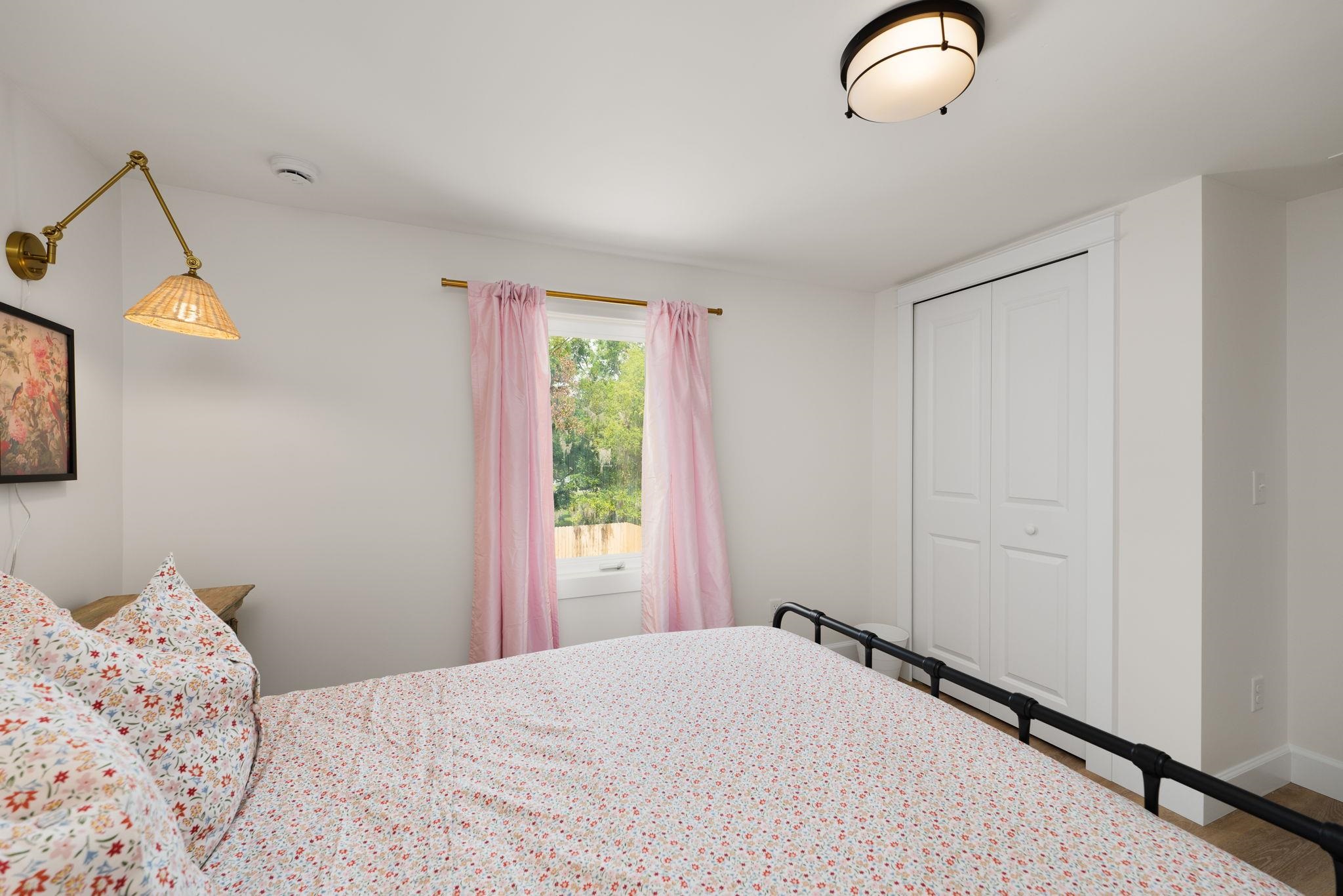 52 Spring Street St. Augustine, FL 32084 - Photo 34 of 45 a bedroom with a bed and a window