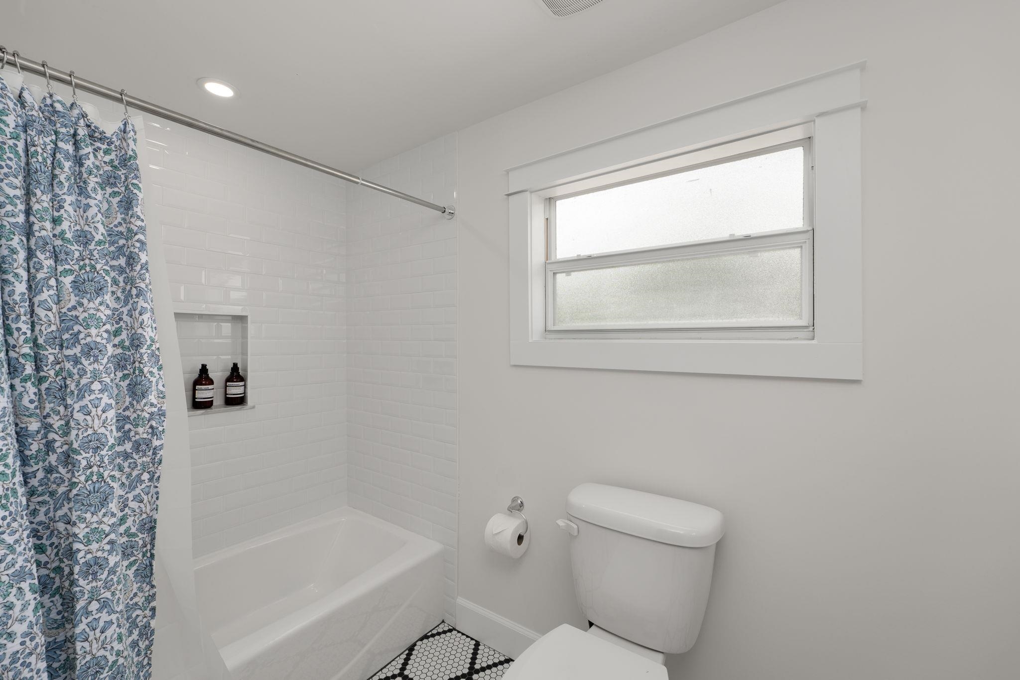 52 Spring Street St. Augustine, FL 32084 - Photo 36 of 45 a bathroom with a toilet and a bathtub