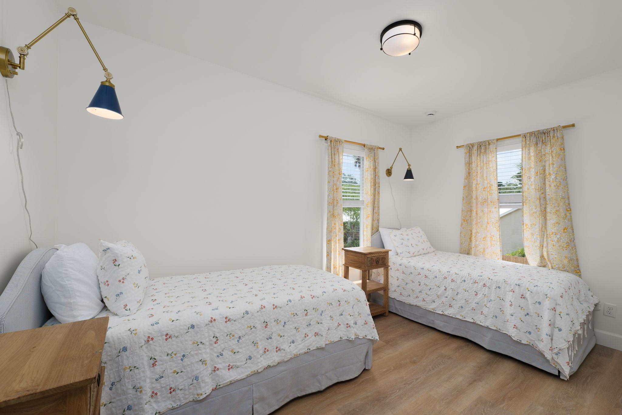 52 Spring Street St. Augustine, FL 32084 - Photo 38 of 45 a bedroom with a bed and wooden floor