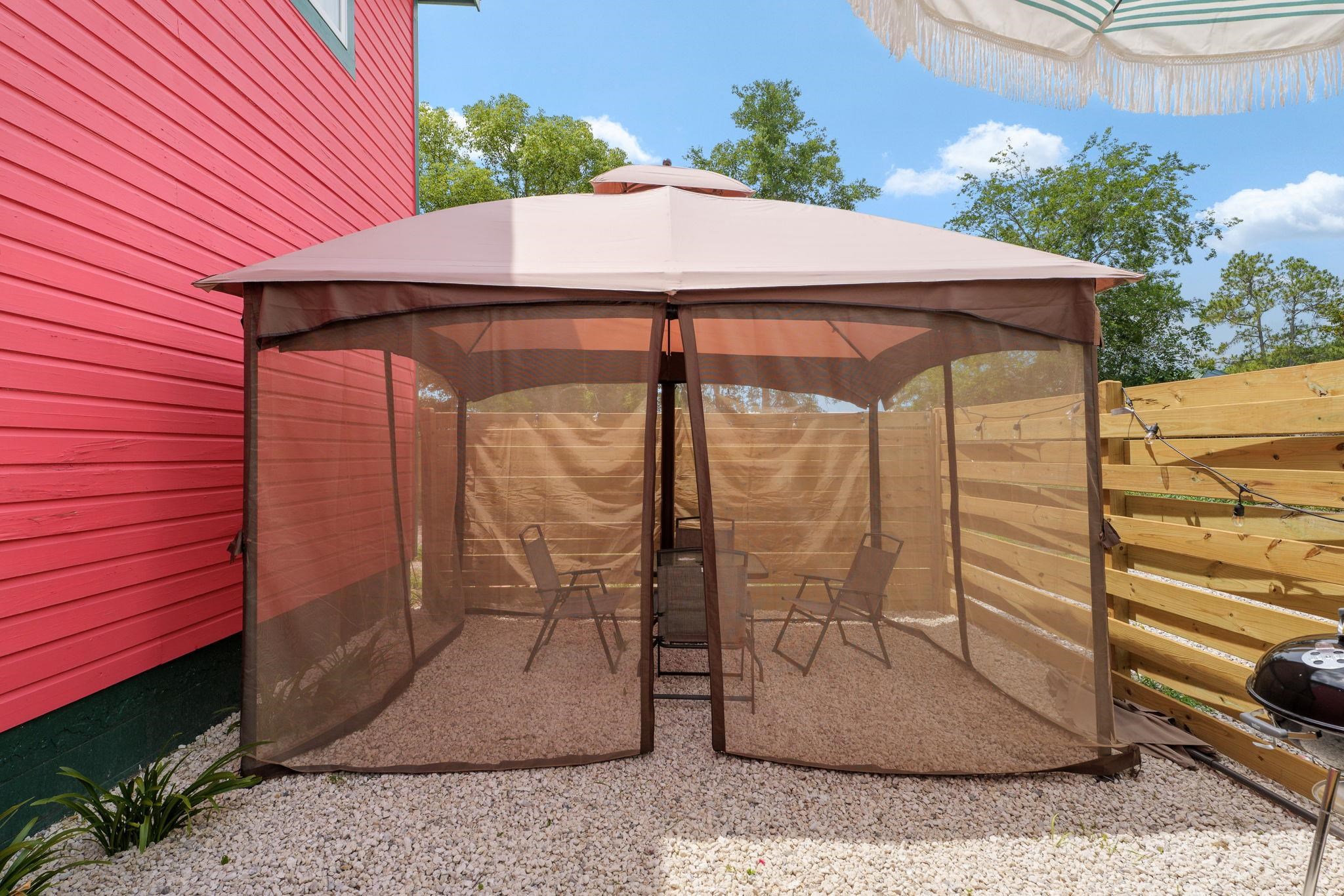 52 Spring Street St. Augustine, FL 32084 - Photo 41 of 45 a view of a patio with table and chairs and potted plants