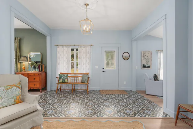 a living room with furniture and a table