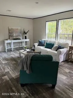 a living room with furniture and a rug