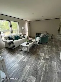 a kitchen with a dining table chairs and a refrigerator