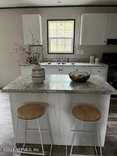 a kitchen with a sink and a refrigerator