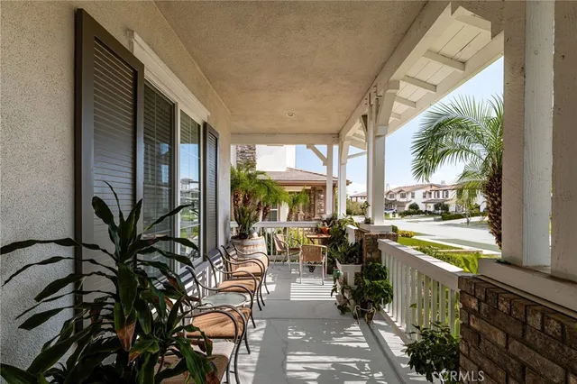 a living room with furniture a fireplace and a large window