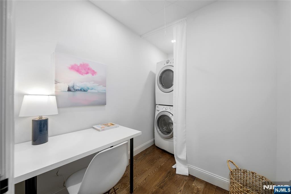 1110 River Road, Unit 102 Edgewater, NJ 07020 - Photo 17 of 18 a bathroom with a sink a toilet and a mirror