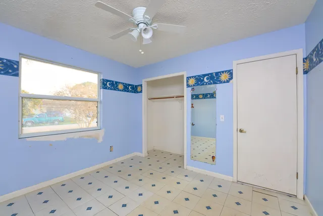 an empty room with fan