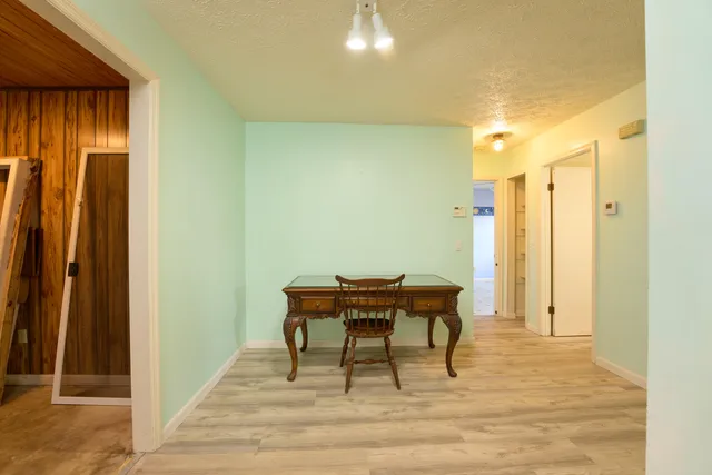 a kitchen with granite countertop a sink and cabinets