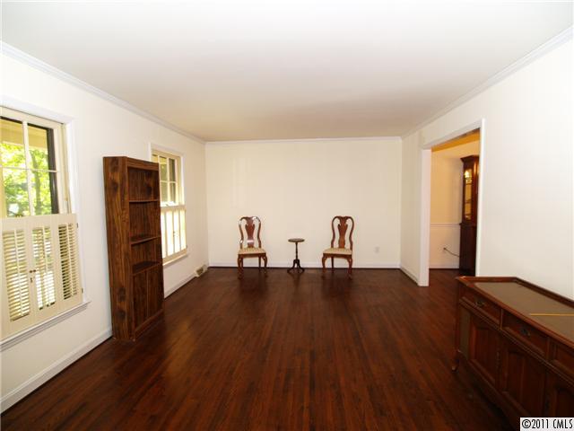5935 Gate Post Road Charlotte, NC 28211 - Photo 2 of 10 a view of an empty room with wooden floor and windows