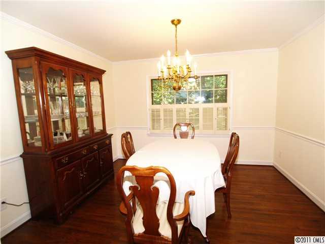 5935 Gate Post Road Charlotte, NC 28211 - Photo 3 of 10 a view of a dining room with furniture window and wooden floor
