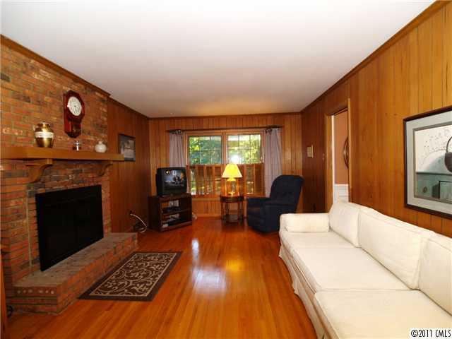 5935 Gate Post Road Charlotte, NC 28211 - Photo 4 of 10 a living room with furniture and a fireplace