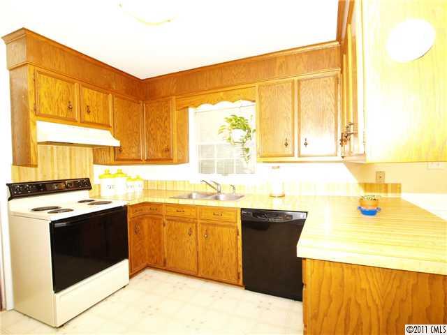 5935 Gate Post Road Charlotte, NC 28211 - Photo 5 of 10 a kitchen with a sink and a stove