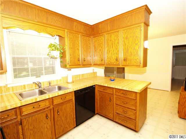 5935 Gate Post Road Charlotte, NC 28211 - Photo 6 of 10 a kitchen with a sink and a window