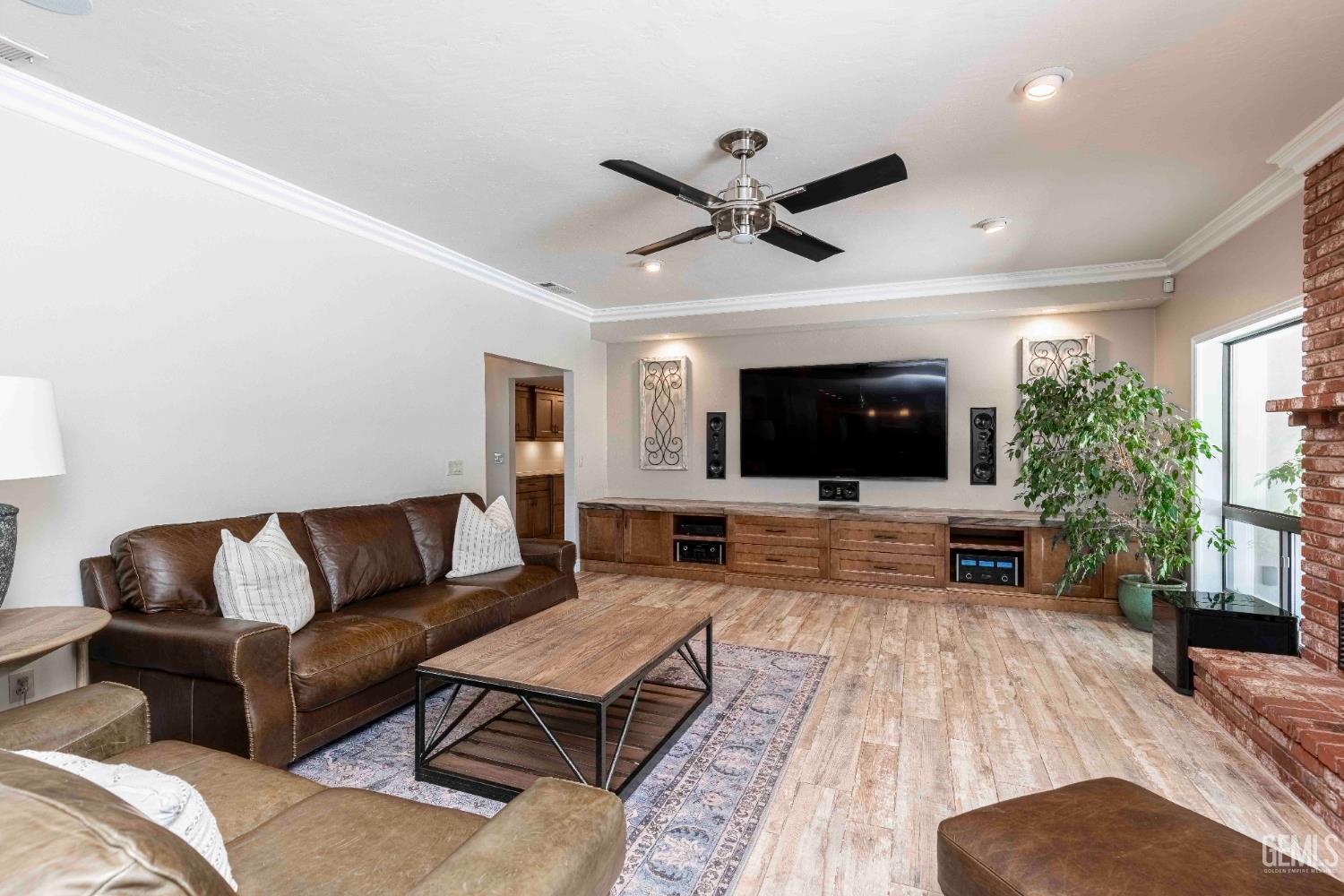 Undisclosed Address Bakersfield, CA 93314 - Photo 12 of 49 a living room with furniture and a flat screen tv