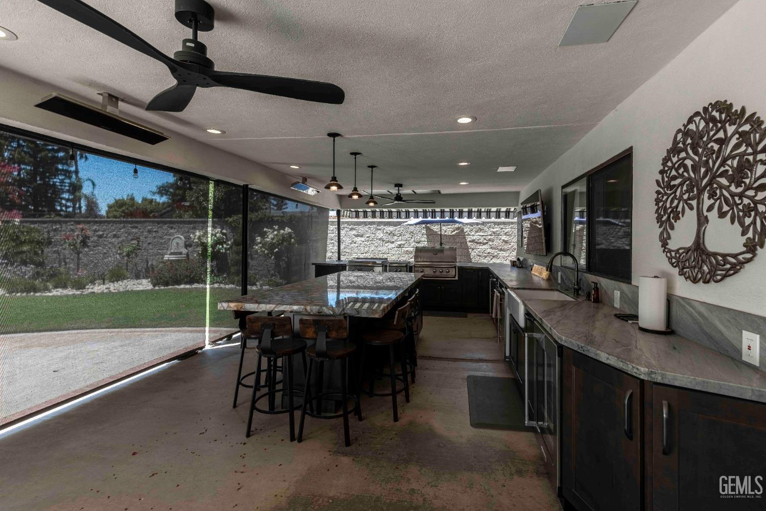 Undisclosed Address Bakersfield, CA 93314 - Photo 20 of 49 a view of a patio with table and chairs