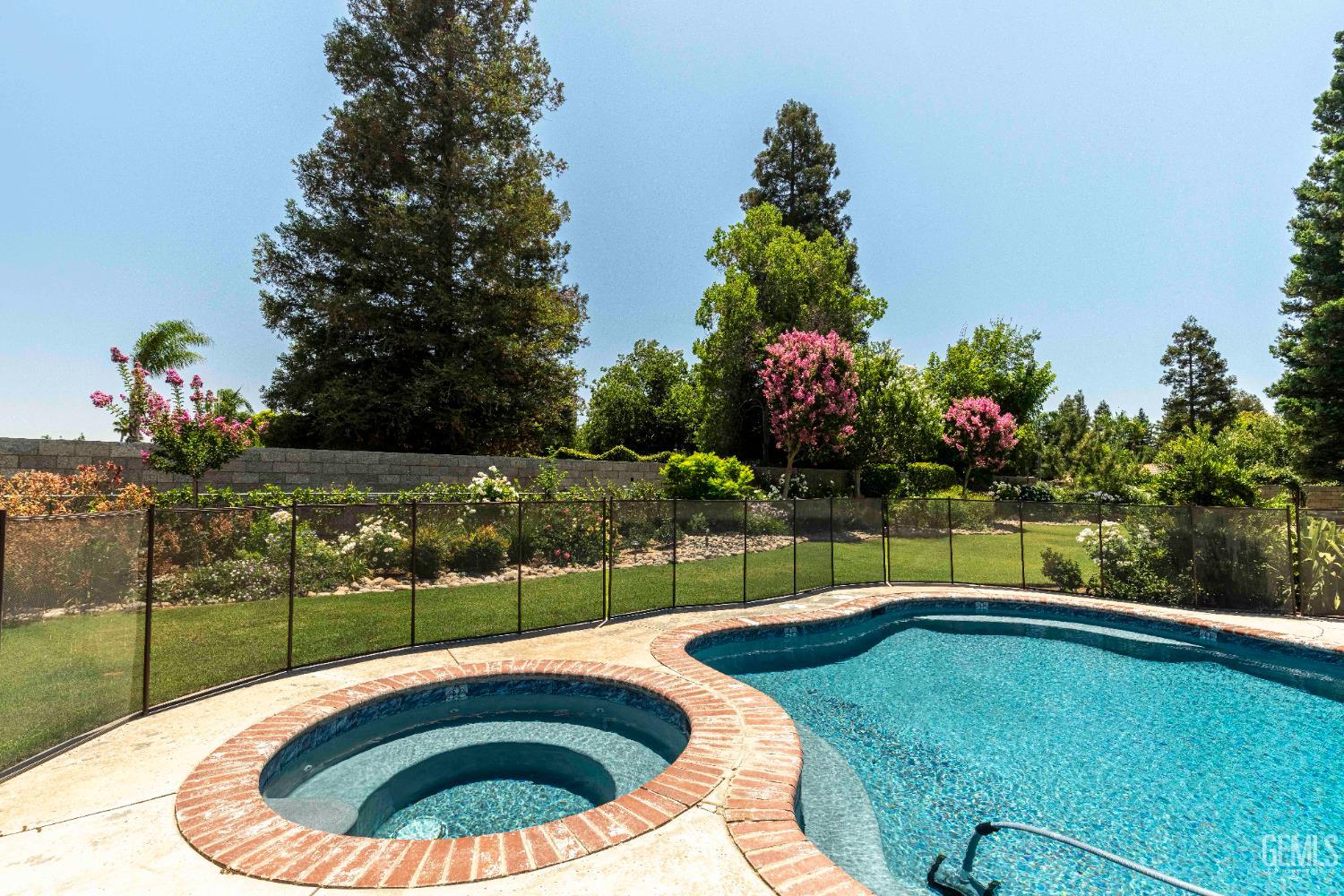 Undisclosed Address Bakersfield, CA 93314 - Photo 24 of 49 a view of swimming pool with a garden