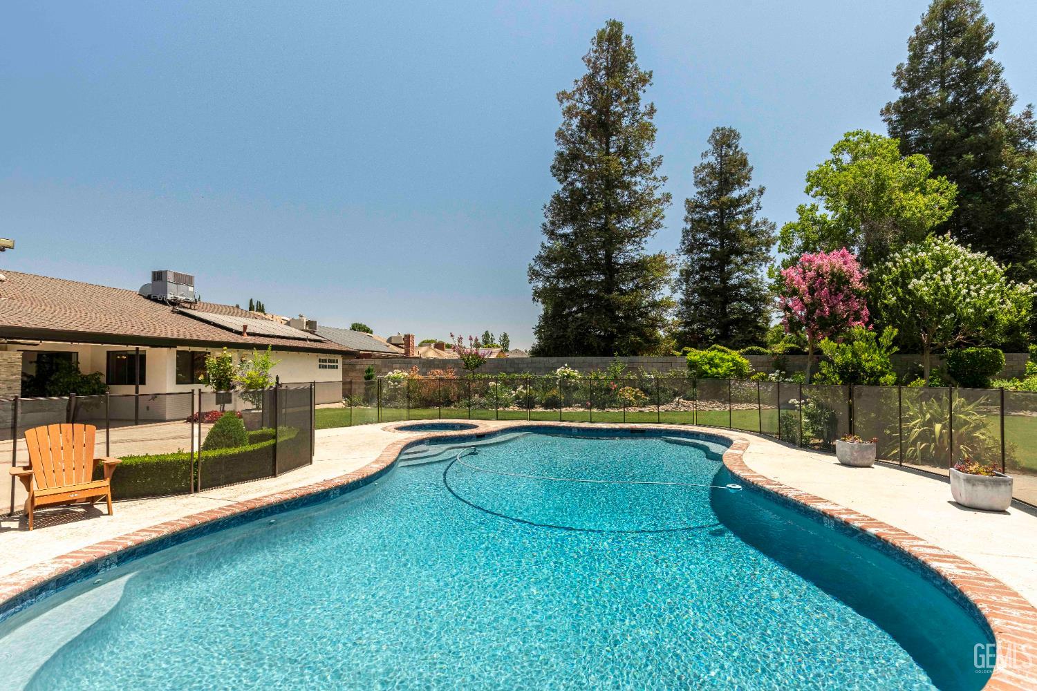 Undisclosed Address Bakersfield, CA 93314 - Photo 26 of 49 a view of a swimming pool with a yard