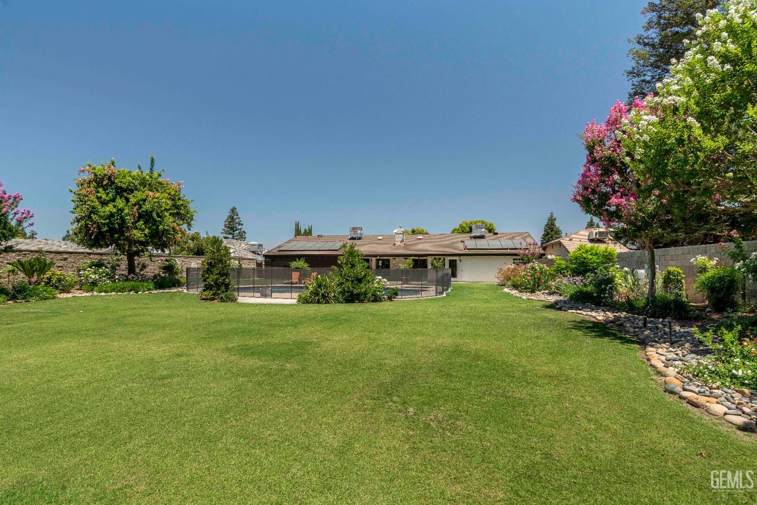 Undisclosed Address Bakersfield, CA 93314 - Photo 28 of 49 a view of a house with a garden and yard