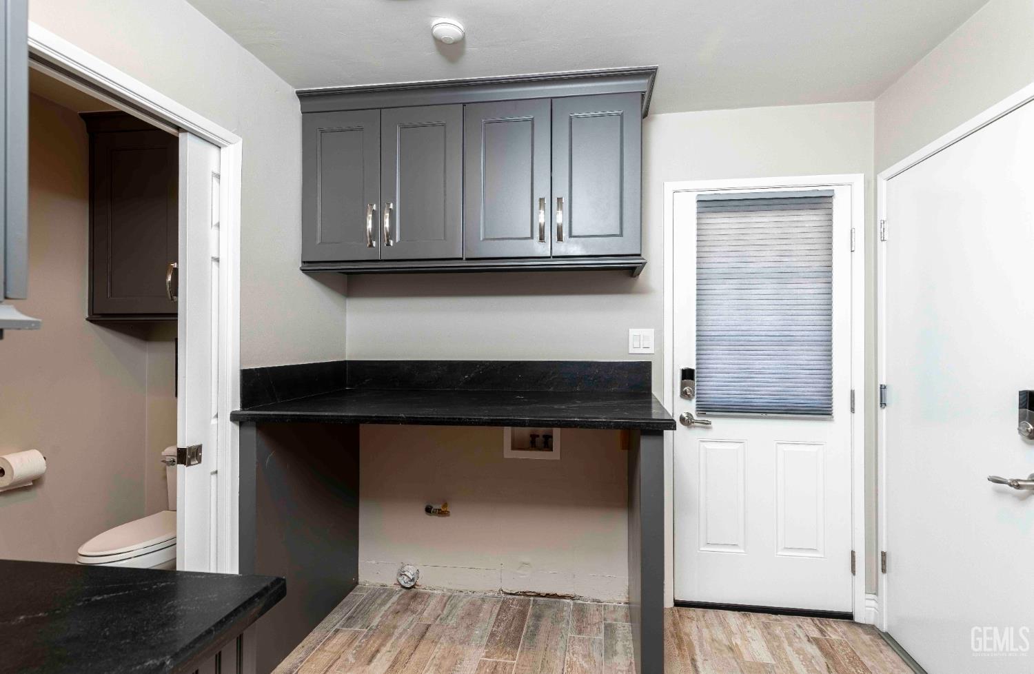 Undisclosed Address Bakersfield, CA 93314 - Photo 30 of 49 a kitchen with a sink and cabinets
