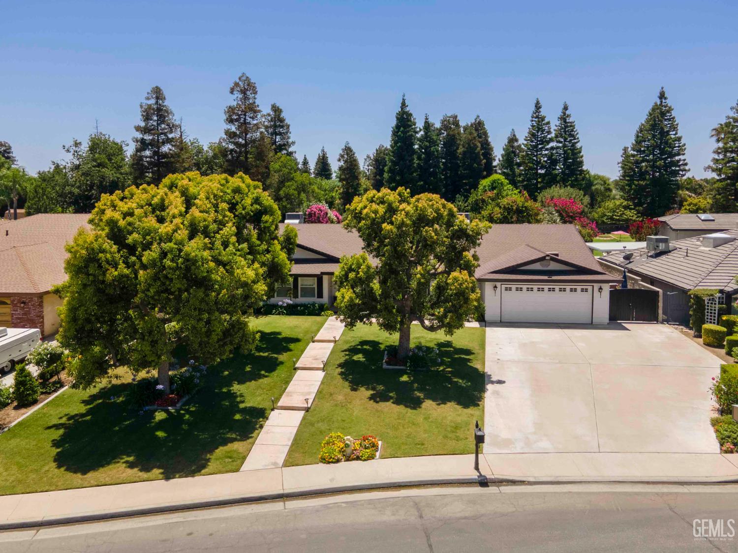 Undisclosed Address Bakersfield, CA 93314 - Photo 3 of 49 a picture of houses with lots of trees