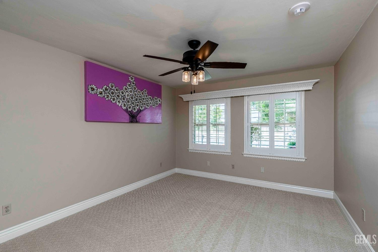 Undisclosed Address Bakersfield, CA 93314 - Photo 32 of 49 a view of a livingroom with a ceiling fan and window