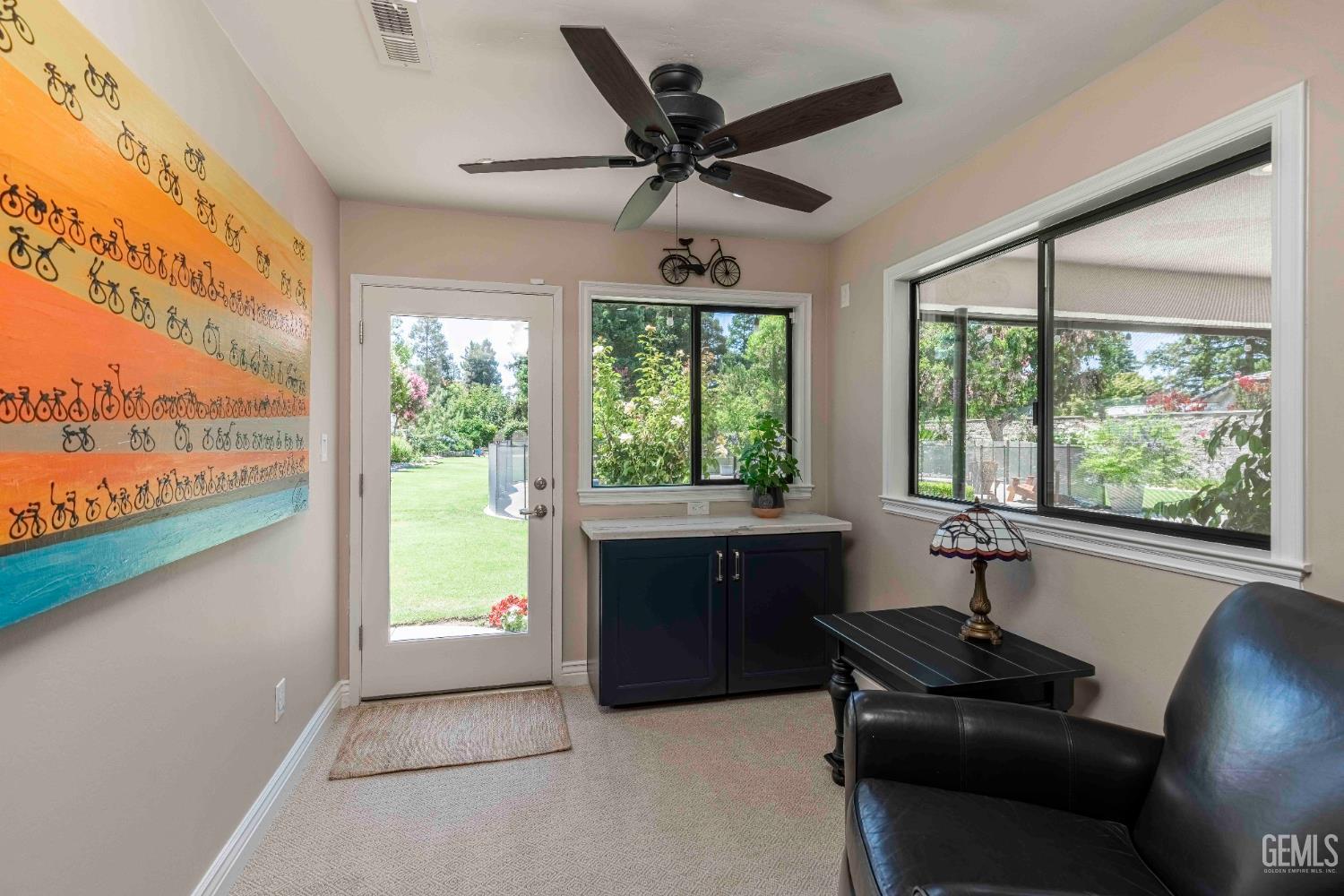 Undisclosed Address Bakersfield, CA 93314 - Photo 35 of 49 a living room with furniture and windows