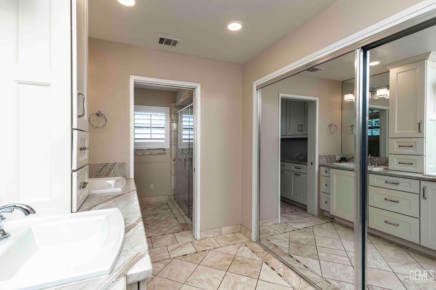 Undisclosed Address Bakersfield, CA 93314 - Photo 36 of 49 a bathroom with a sink a toilet and shower