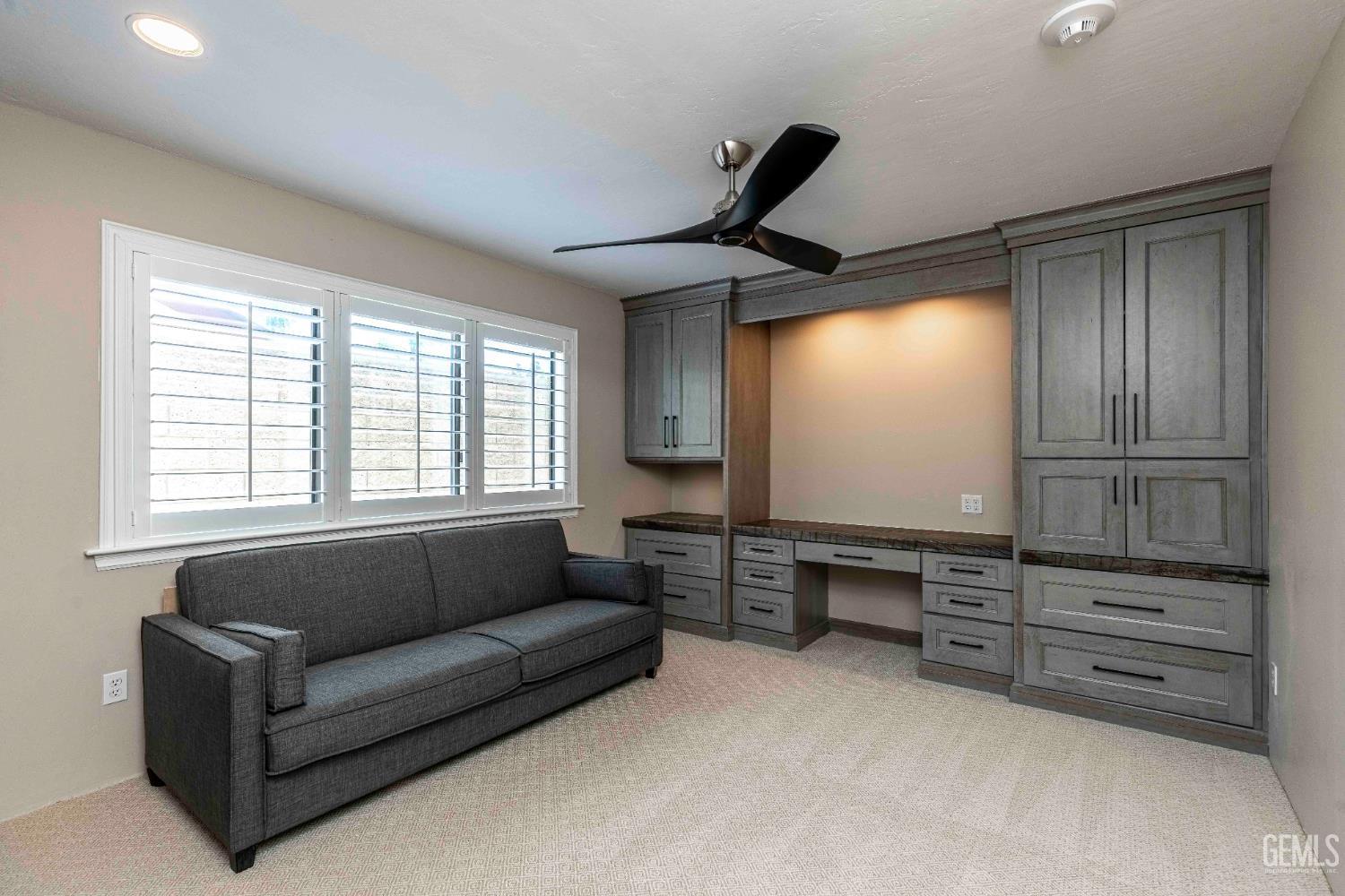 Undisclosed Address Bakersfield, CA 93314 - Photo 39 of 49 a living room with furniture cabinets and window